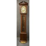 A contemporary longcase clock in a mahogany veneered case, H. 205cm.