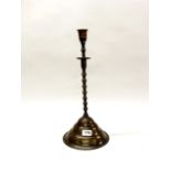An early 19th century Turkish bronze candlestick, H. 46cm.