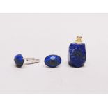 A pair of lapis lazuli cufflinks with a lapis perfume bottle pendant.