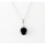 A matching 18ct white gold black diamond, approx. 3.24ct, pendant and chain, L. 40cm.