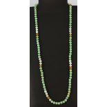 A single row necklace of mixed colour jade beads (7.5mm), necklace L. 78cm.