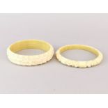 Two early 20th century carved ivory bangles.