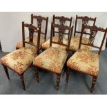 A set of six Edwardian mahogany dining chairs.