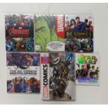 Six Marvel and DC comics reference books.