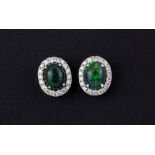 A pair of 18ct white gold cluster earrings set with a cabochon cut black opal, approx. 1.79ct
