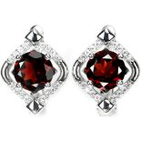 A pair of 925 silver earrings set with round cut garnets and white stones, L. 1.5cm.