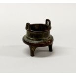 A 19th century Chinese miniature bronze censer, H. 5.5cm.
