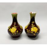 A pair of early 20th century Bretby glazed pottery vases, H. 28cm.