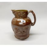 An early 19th century glazed stoneware wine jug, H. 26cm. Slight A/F.