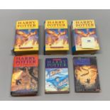 Three Harry Potter first edition hardbacks plus a further hardback, paperback and a copy of the