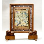 A 19th century Chinese carved walnut table screen with original tapestry featuring forbidden stitch,