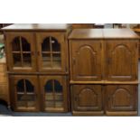 A group of oak display cabinets and storage cabinets.
