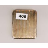 An Art Deco hallmarked silver and gold band cigarette case, 8 x 10cm.