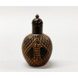 A Chinese carved horn snuff bottle, H. 8cm.