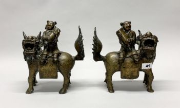 A superb pair of 18th/ early 19th century Sino-Tibetan bronze liondog incense holders, H. 25cm.