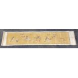 An old Chinese painting on fine linen mounted on a silk scroll depicting cats trying to catch