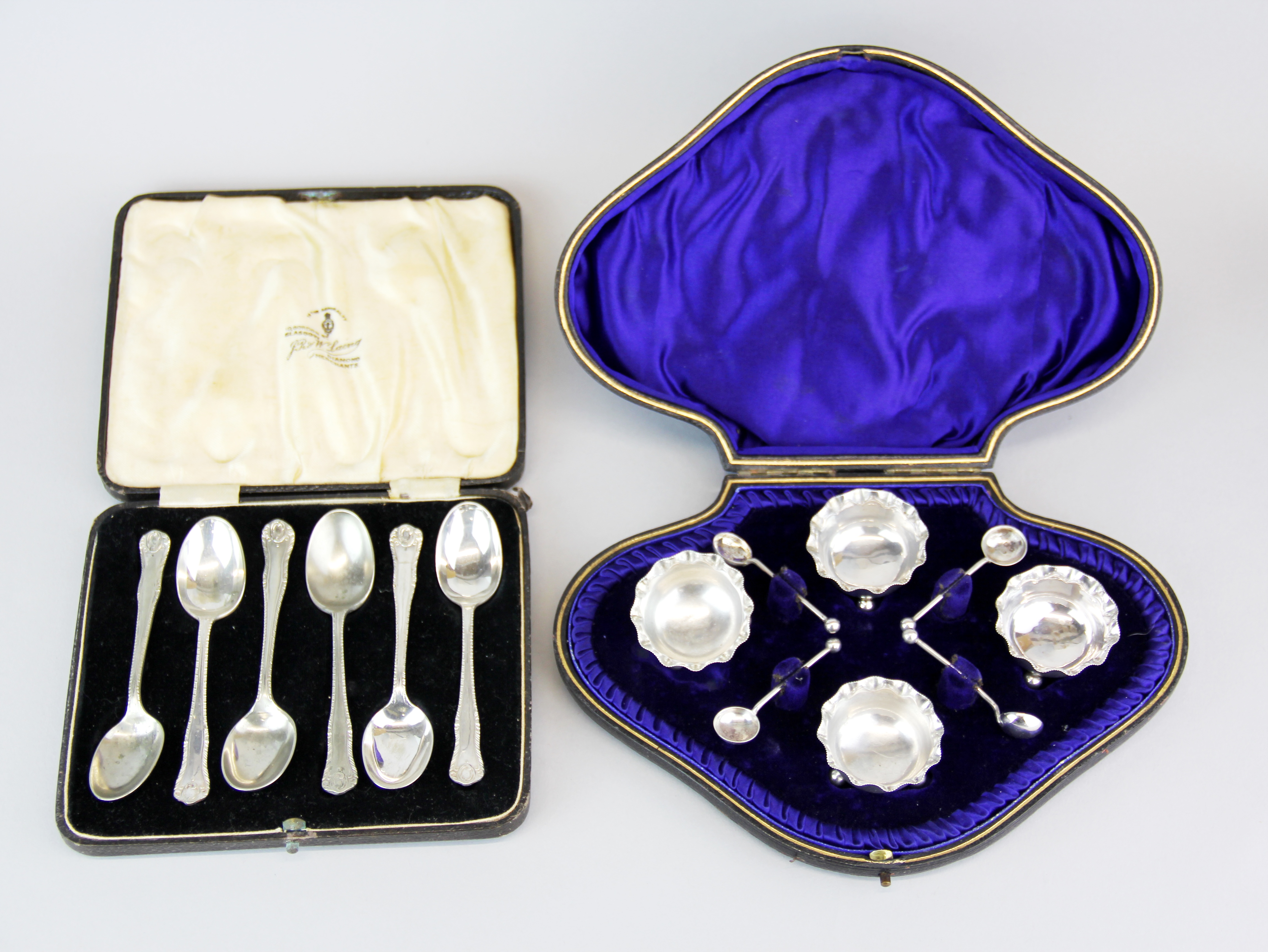 A set of six silver plated tea spoons with a hallmarked silver salt set.