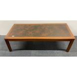 A 1970's teak coffee table, 54 x 130 x 40cm.