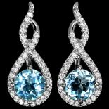 A pair of 925 silver drop earrings set with blue topaz and white stones, L. 2.5cm.