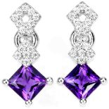 A pair of 925 silver earrings set with step cut amethysts and white stones, L. 1.7cm.