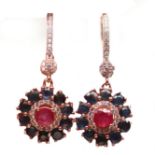 A pair of 925 silver rose gold gilt drop earrings set with round cut ruby and sapphires, L. 3.8cm.