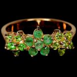 A 925 silver triple cluster ring set with emeralds, peridots and tsavorite, (M).