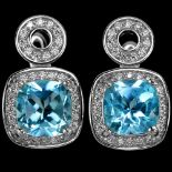 A pair of 925 silver earrings set with oval cut blue topaz and white stones, L. 1.7cm.