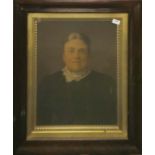 A Victorian watercolour enhanced portrait photograph of a lady in a rosewood veneered frame, frame