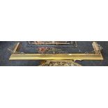 A 19th century ornate brass fireplace fender, W. 183cm, D. 40cm, together with three half tools.