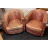 A pair of vintage leather upholstered tub chairs, W. 73cm.