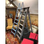 Two vintage painted wooden step ladders, tallest H. 205cm.