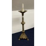 A 19th century gothic style brass candlestick converted as a table lamp, H. 65cm.