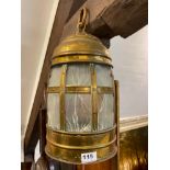 A 1920's hammered brass porch lantern, embossed veta hominia ut umbra fujit, H. 44cm.