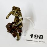A cold painted Vienna style bronze figure of a cat with a pair of red trousers, H. 5.5cm.