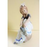 Lladro Nao Porcelain Figurine - Tying My Shoe 0479   A Lovely Lladro Nao Figurine of little girl