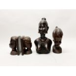A pair of African carved figured ebony bookends with two busts of young women, tallest H. 31cm.