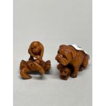 Two carved fruitwood Netsuke, H. 4cm (monkey missing an eye).
