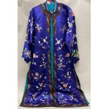 A beautiful mid 20th century Chinese hand embroidered blue silk robe, L. 125cm.