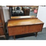 A 1970's teak dressing table, W. 138cm, H. 127cm.