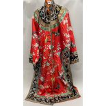 A beautiful mid 20th century Chinese hand embroidered red silk robe, L. 125cm.