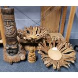 A large root carving (H. 61cm) with two rustic root bowls and a wooden Buddha.