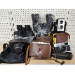 Two pairs of binoculars with cameras etc.