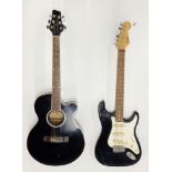 A black Encore electric guitar together with an Eastcoast electric acoustic guitar.
