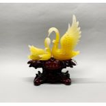 A Chinese presentation resin figure of a family of swans, H. 33cm.