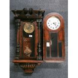 Two antique wall clocks.