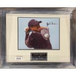 Autograph interest: A framed signed photograph of Tiger Woods (American b. 1975). Frame size 45 x