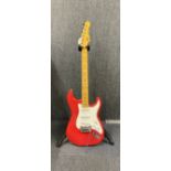 A G&L tribute series Legacy electric guitar with stand.
