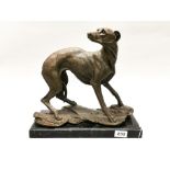 A large bronze figure of a greyhound after J. B. Mene on a black marble base, H. 32cm.