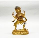 A Tibetan gilt bronze figure of a multi head and multi armed protective deity (Avalokiteshvara),