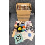 A box of 45 RPM single records.